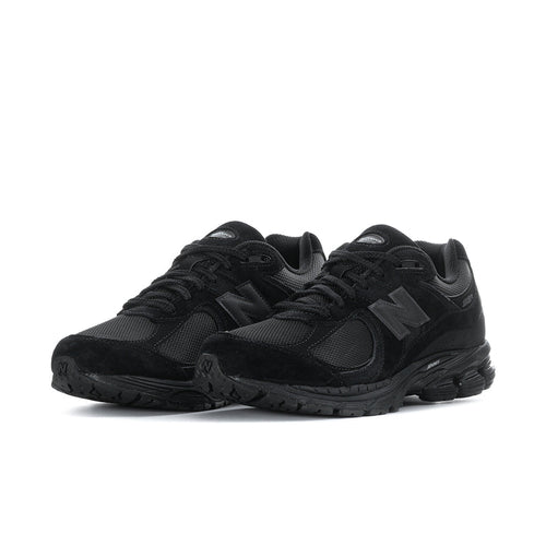 Men's black lace-up sneakers with mesh upper and textured rubber outsole