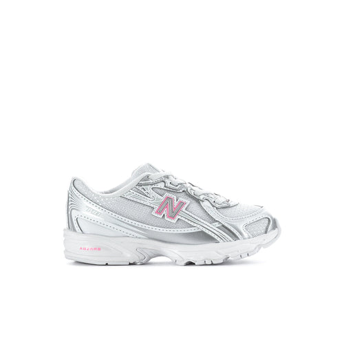 Silver toddler sneaker with pink N logo, lace-up design and chunky cushioned sole.