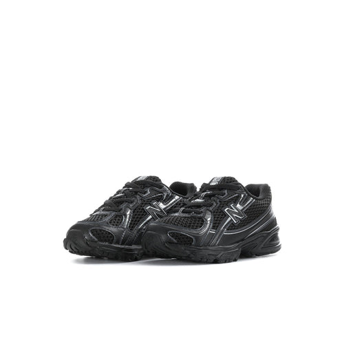 Black toddler lace-up sneakers, side view with silver N logo and cushioned sole