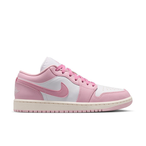 Women's low-top sneakers in pink and white with lace-up front and swoosh logo