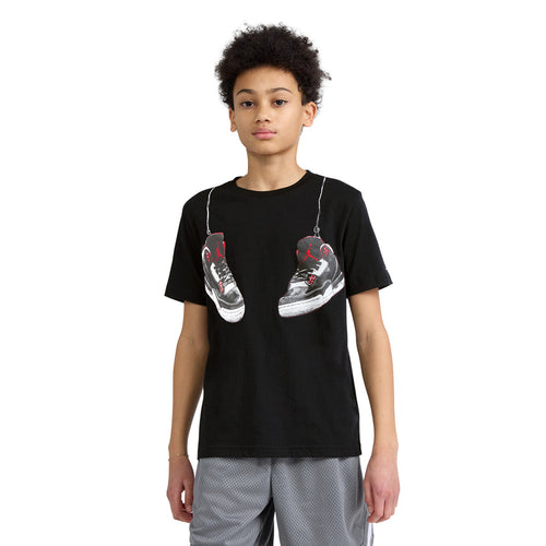 Black youth T-shirt with front sneaker graphic, red/white details, crew neck