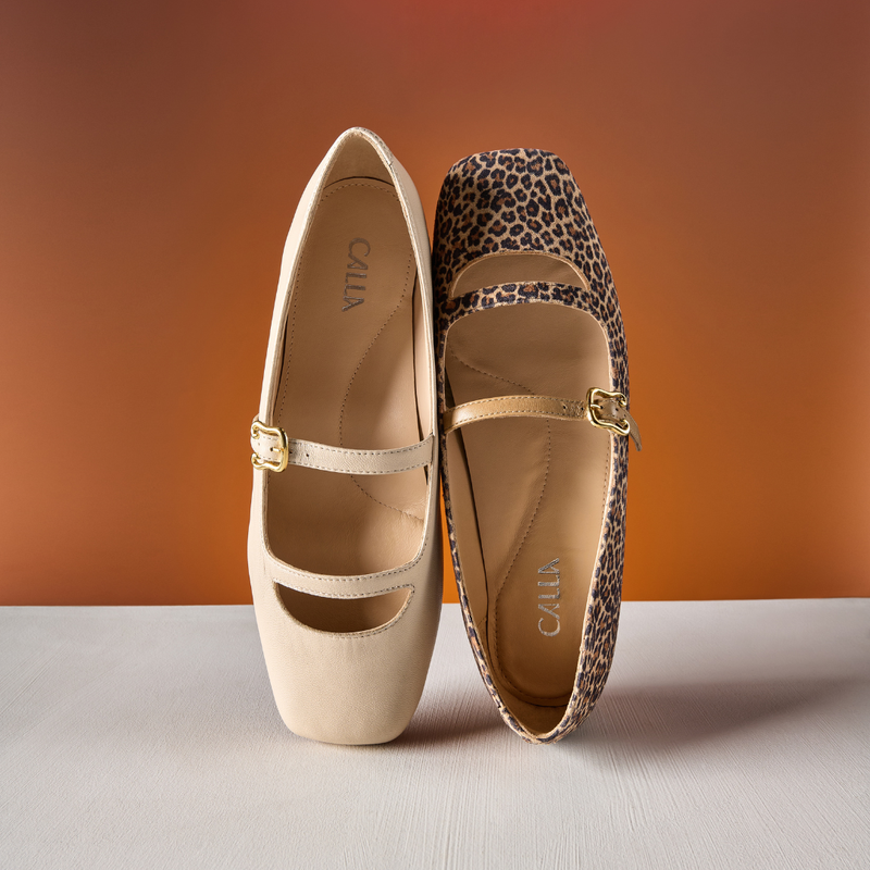 Pair of beige and leopard print shoes with on a gradient background