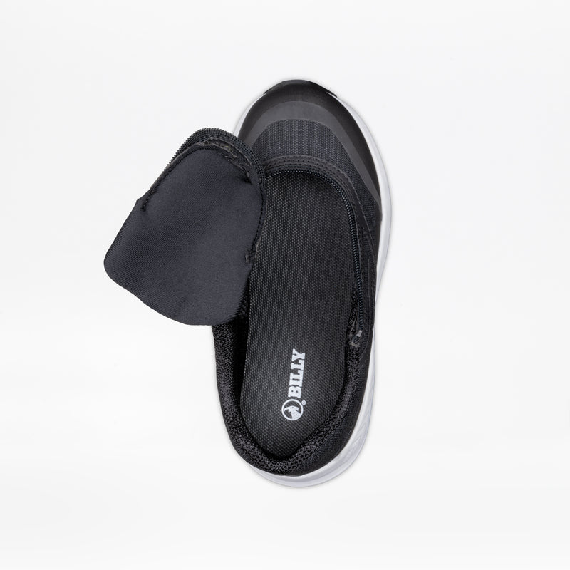 The Black BILLY Goat by BILLY Footwear is an AFO-friendly kids’ shoe with a wide, adjustable flap that reveals the branded inner sole. Shown top-down on a white background, it provides comfort and accessibility.