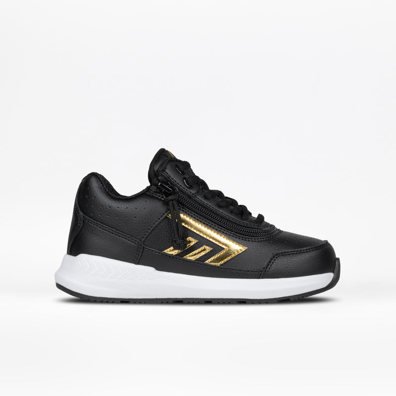 The Kids'/Toddler Goat Hoop by BILLY Footwear features a black/gold design with a white sole and black laces. This AFO-friendly sneaker is shown against a plain white background, highlighting its gold metallic side detail.