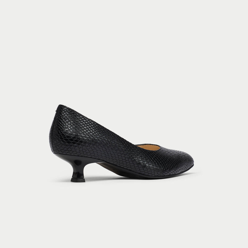 Black heeled shoe on a white background