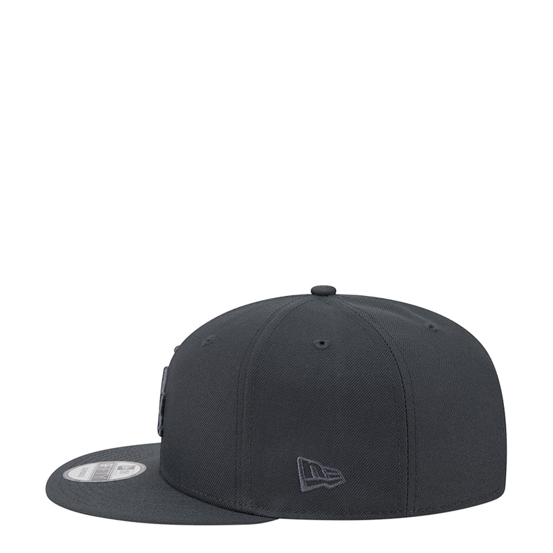 Dark charcoal baseball cap, front view with tonal logo patch