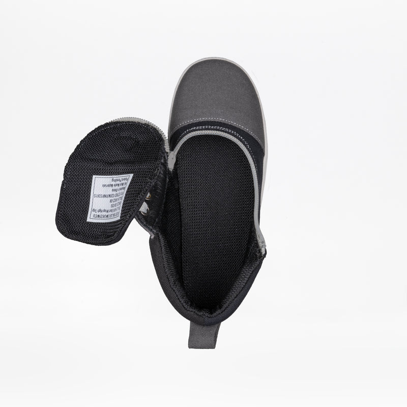 A top-down view of the BILLY Footwear FINAL SALE - Grey Colorblock BILLY D|R Short Wrap High Tops shows a single shoe with the tongue out, exposing a fabric care label inside. This wide kids' shoe features removable insoles. Photographed on white.