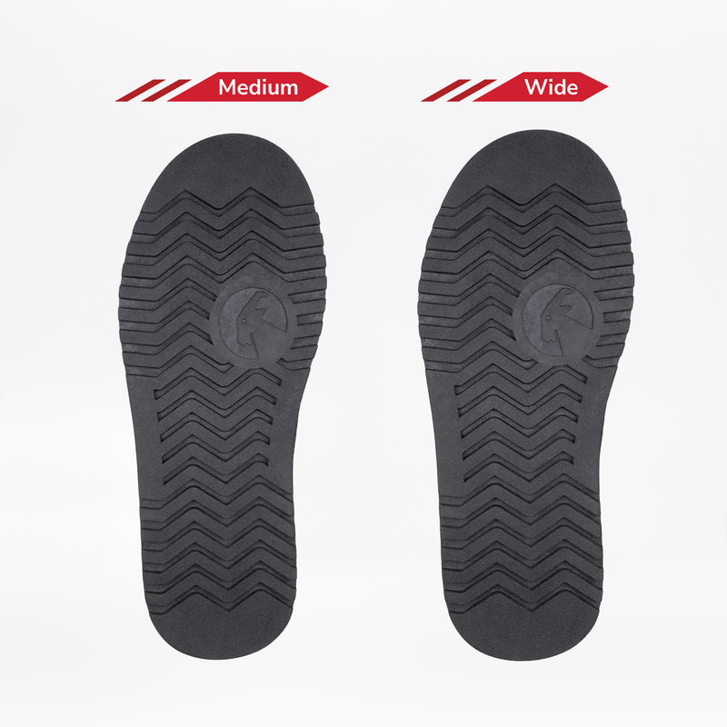 Two black soles of the Women's Black BILLY Cozy II by BILLY Footwear are shown side by side on a white background, labeled Medium and Wide to show the difference in shoe width.