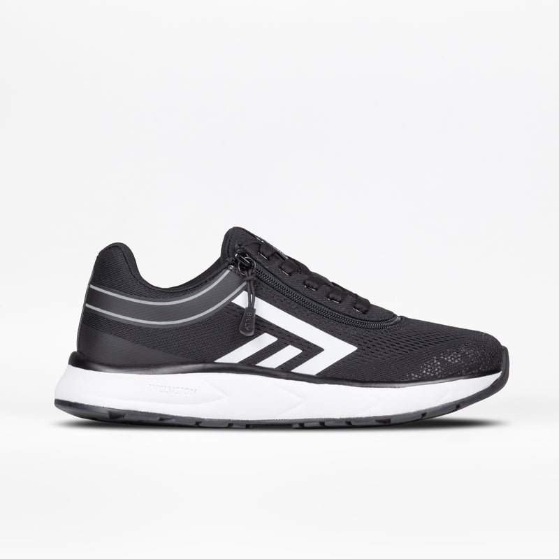 The Women's Black/White BILLY Sport Inclusion by BILLY Footwear features a black upper with white accents, a geometric side design, a zipper closure, a white midsole, and black outsole. The shoe is shown on a plain white background.