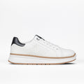 The Women's White Leather BILLY Comfort Luxe sneaker by BILLY Footwear features a black heel tab, perforated sides, white laces, and a brown-accented sole. Displayed on a white background, these sensory-friendly shoes are ideal for everyday comfort and style.